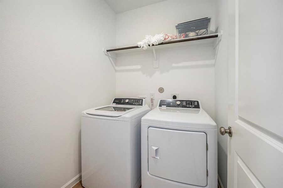 Laundry room is located off the front entry.