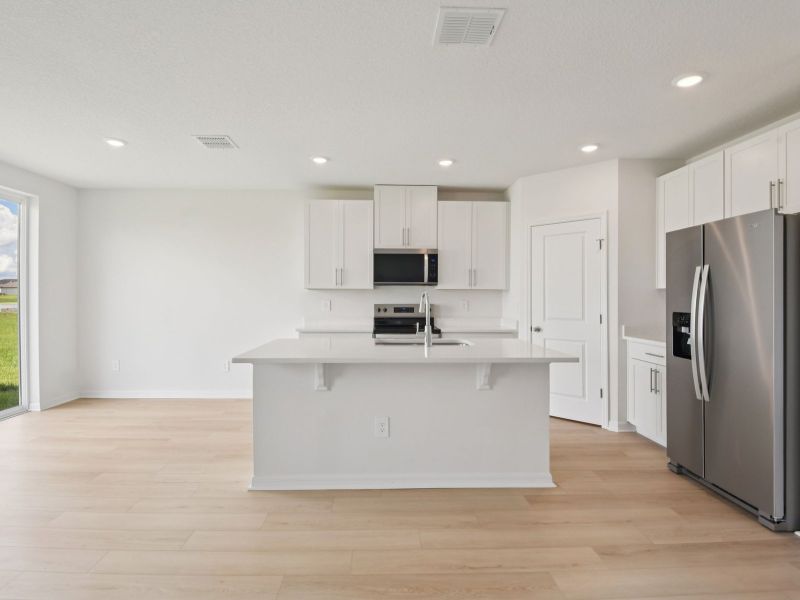 Furnished interior view inside a new home in The Grove at Stuart Crossing - Classic Series, Bartow (Image 4).