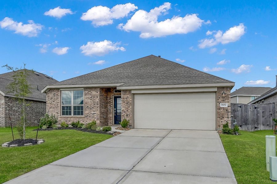 Front exterior of a new home in Tavola: Wildflower II Collection, New Caney, TX, highlighting curb appeal (Image 21).