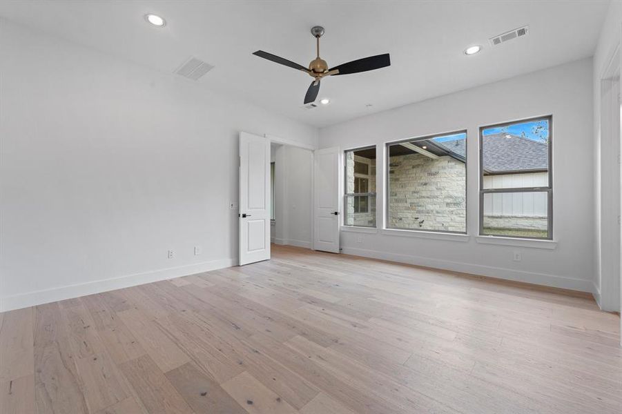 Primary Bedroom with Engineered Hardwood Flooring