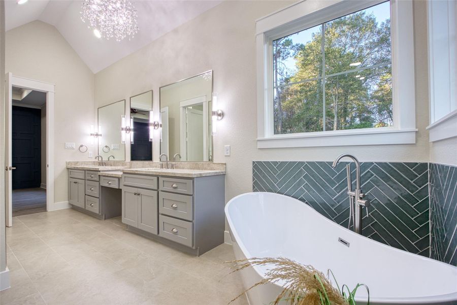 En Suite Bath featuring double sinks and large soaking tub En Suite Bath featuring double sinks and large soaking tub