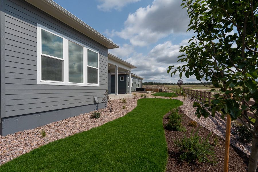 Exterior details and patio area of a home in Wolf Ranch - Enclave Collection, Colorado Springs (Image 4).