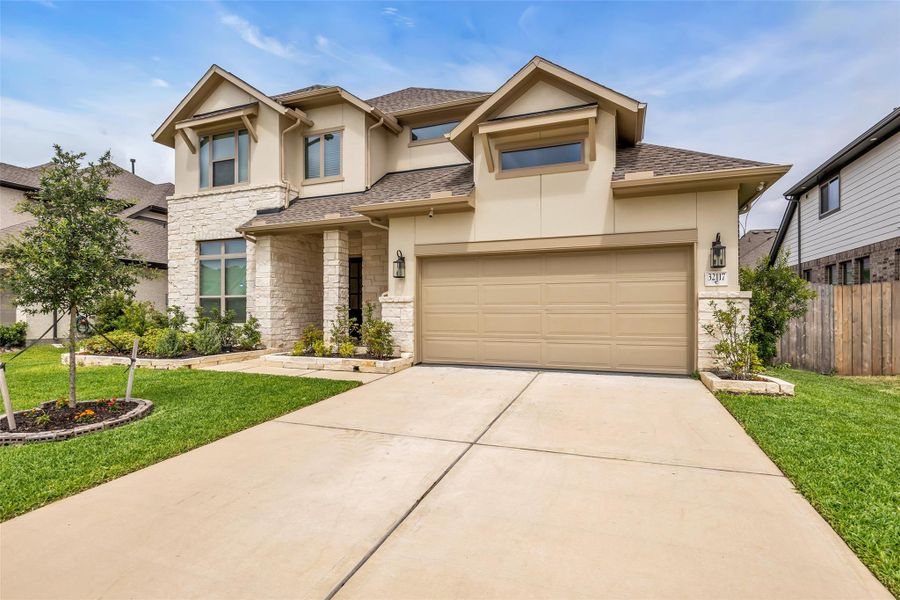 Front exterior of a new home in , Conroe, TX, highlighting curb appeal (Image 22).