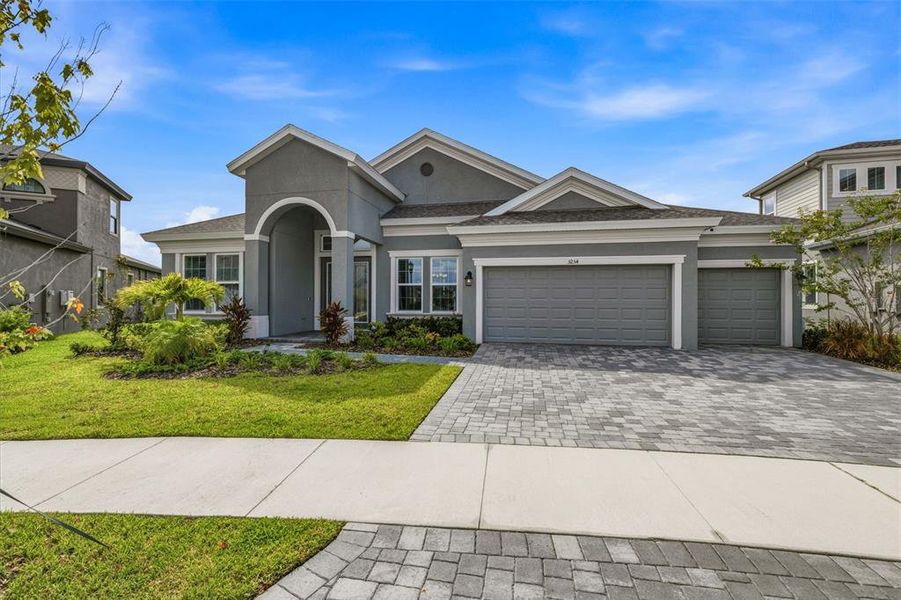 Front exterior of a new home in Waterset, Apollo Beach, FL, highlighting curb appeal (Image 22). Front exterior of a new home in Waterset, Apollo Beach, FL, highlighting curb appeal (Image 22).
