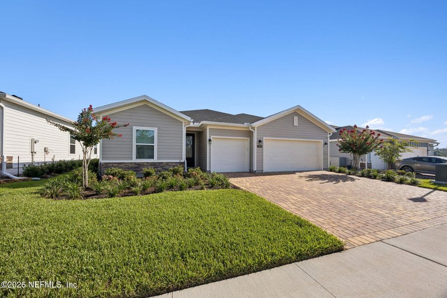 Front exterior of a new home in Edenbrooke at Hyland Trail | 55+, Green Cove Springs, FL, highlighting curb appeal (Image 2). Front exterior of a new home in Edenbrooke at Hyland Trail | 55+, Green Cove Springs, FL, highlighting curb appeal (Image 2).