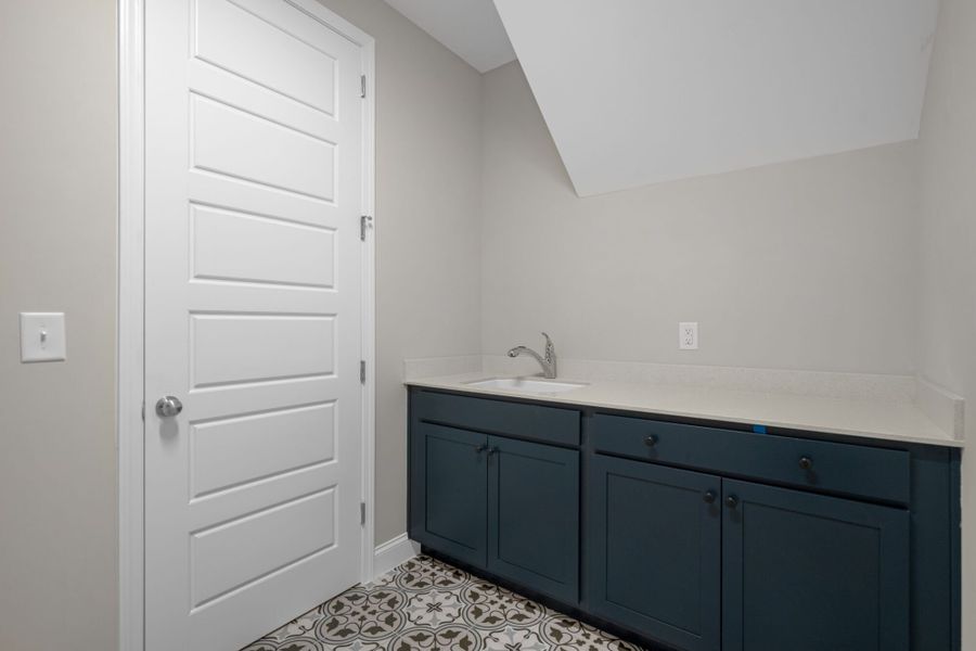 Florissant - Laundry folding area with laundry sink