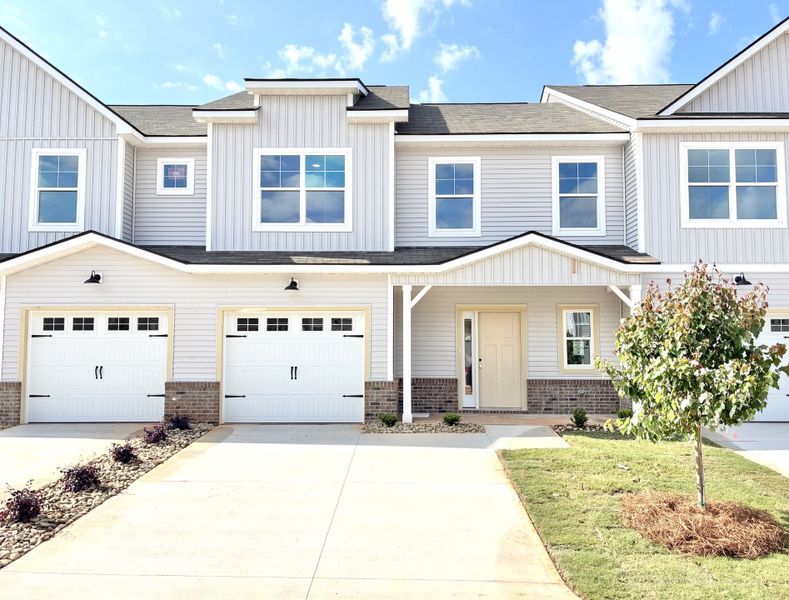 Front exterior of a new home in Holly Ridge, Greenville, SC, highlighting curb appeal (Image 1). Front exterior of a new home in Holly Ridge, Greenville, SC, highlighting curb appeal (Image 1).