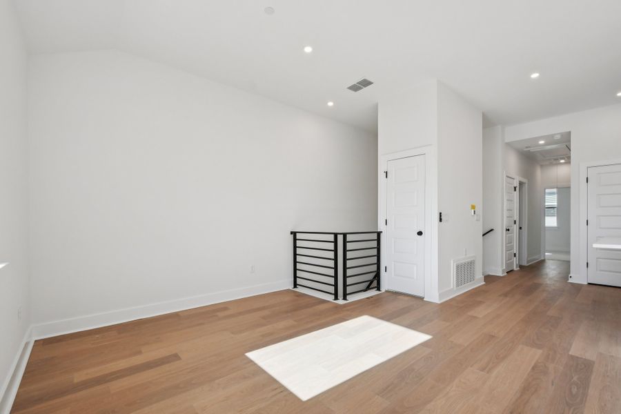 Spacious, unfurnished interior of a new home in Koenig Townhomes, Austin (Image 20).