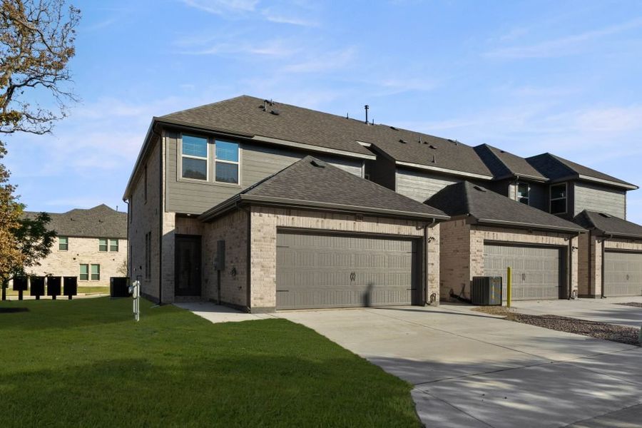 Representative exterior photo of a completed home built from the Conroe by Impression Homes in Timber Ridge, Corinth, TX (Image 26). Representative exterior photo of a completed home built from the Conroe by Impression Homes in Timber Ridge, Corinth, TX (Image 26).