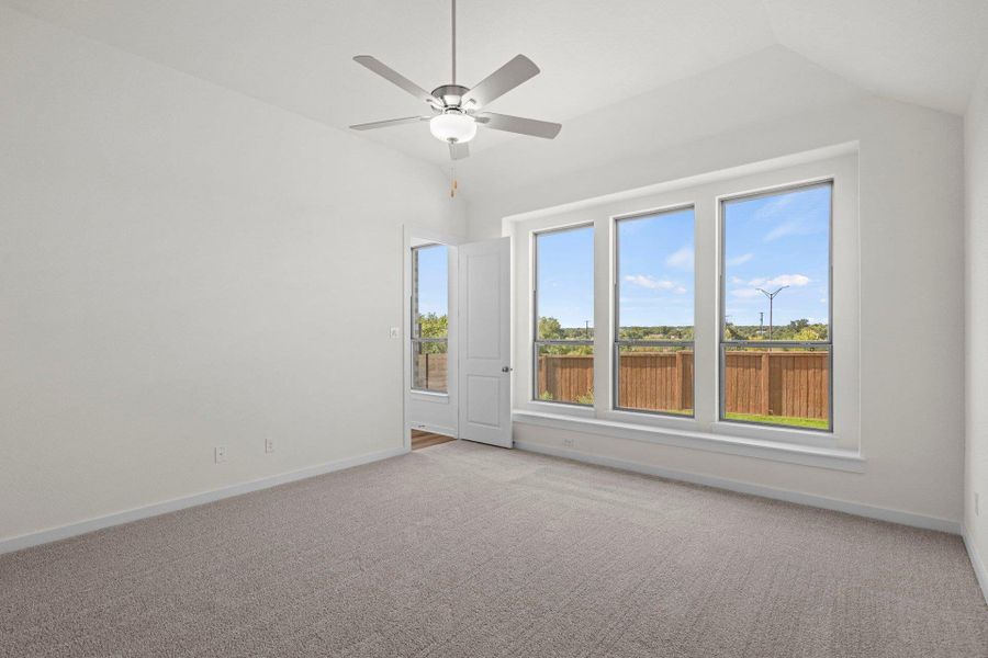 Primary Bedroom with elevated ceiling