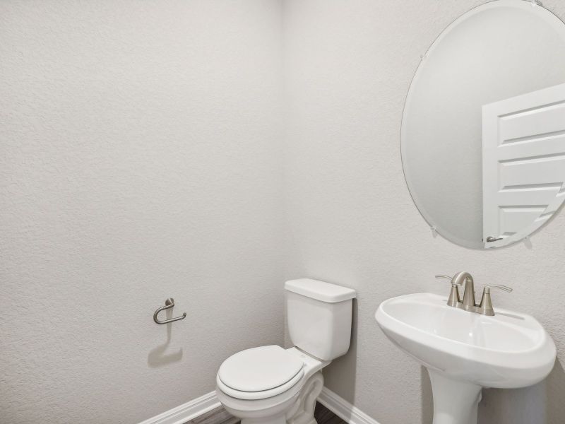 The powder bathroom is very convenient when hosting guests.