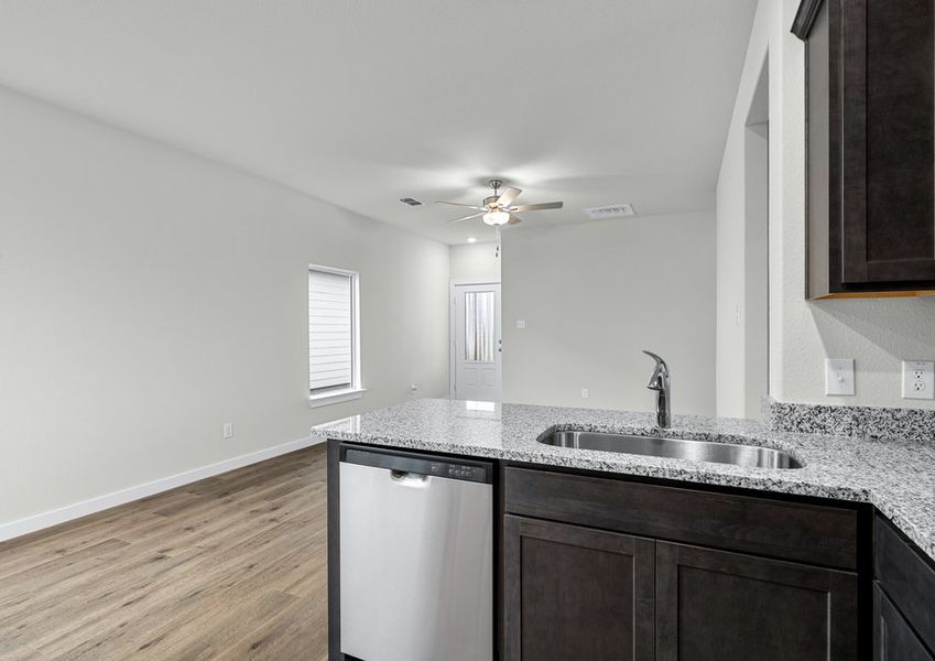 The kitchen looks out into the family room. The kitchen looks out into the family room.