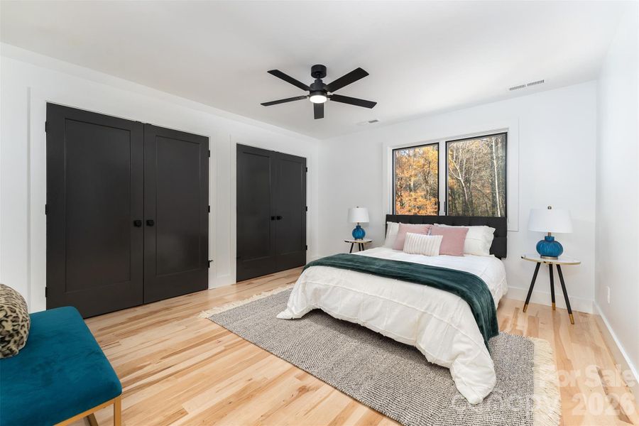 Primary bedroom has double closets with built-in storage
