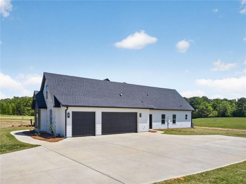 Front exterior of a new home in The Meadows at Lake Circle, Buchanan, GA, highlighting curb appeal (Image 28).