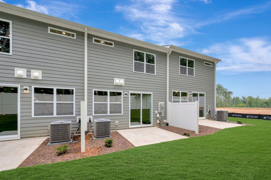 Exterior details and patio area of a home in Ashmore Townes, Garner (Image 20). Exterior details and patio area of a home in Ashmore Townes, Garner (Image 20).