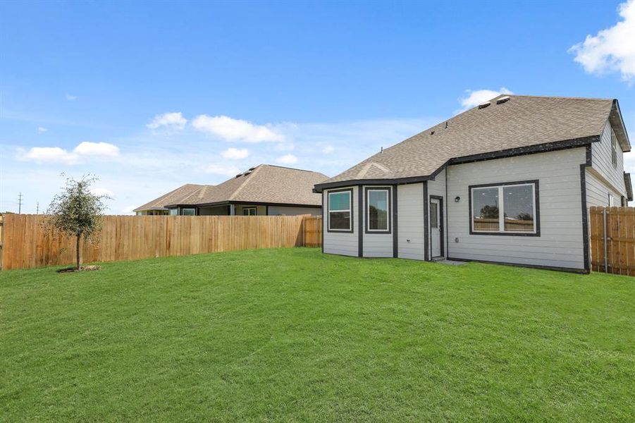 Front exterior of a new home in Rocky Creek Crossing, Fort Worth, TX, highlighting curb appeal (Image 13). Front exterior of a new home in Rocky Creek Crossing, Fort Worth, TX, highlighting curb appeal (Image 13).