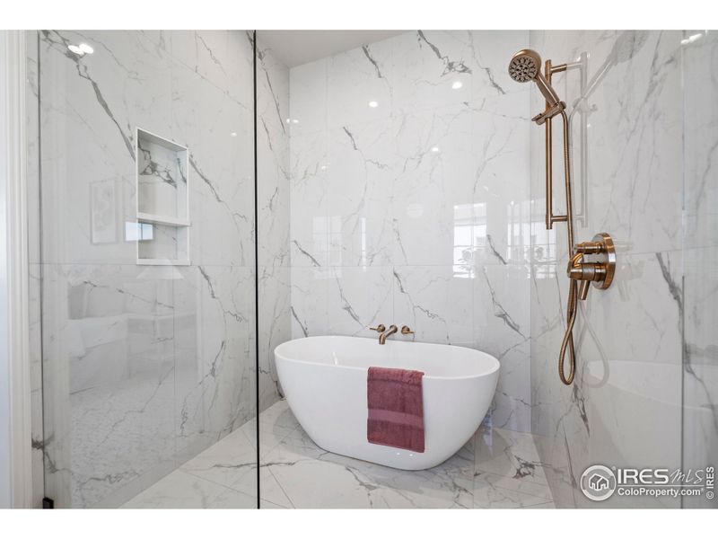 Beautifully tiled bath and shower combo
