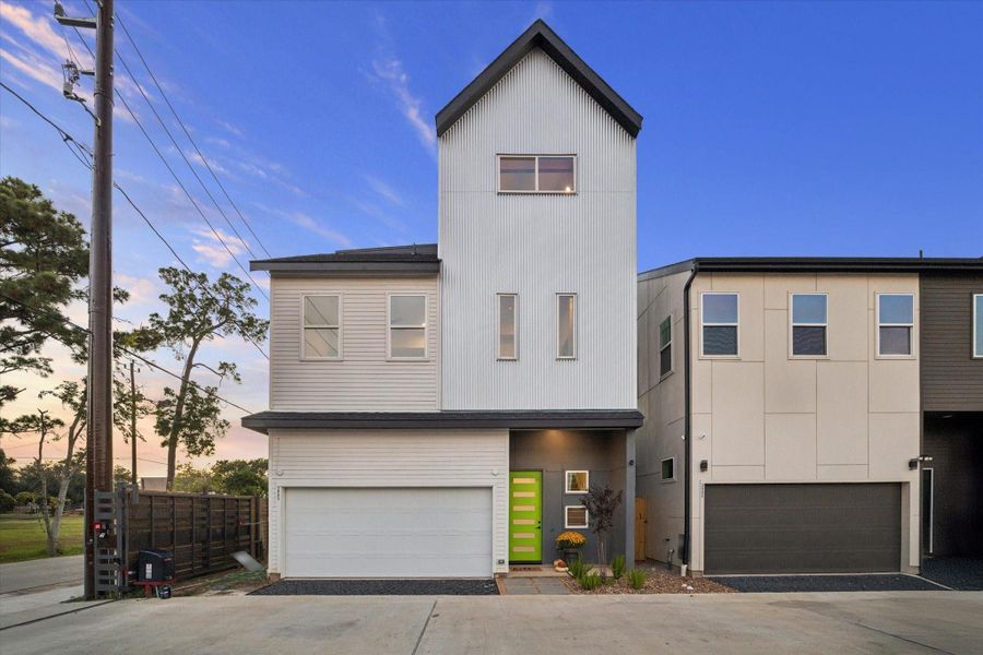 The current model home is a modern 3 story home with elegant finishes, yard space and a balcony with sunset views.