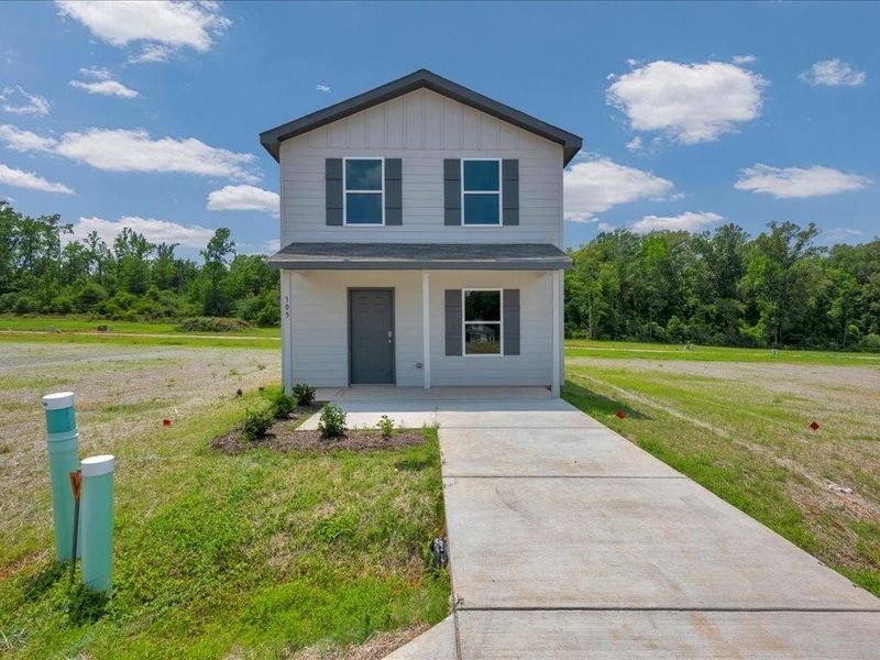 Front exterior of a new home in Redland Estates, Lufkin, TX, highlighting curb appeal (Image 1). Front exterior of a new home in Redland Estates, Lufkin, TX, highlighting curb appeal (Image 1).