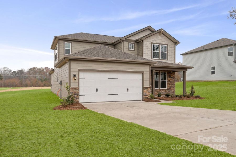Front exterior of a new home in Running Creek, Locust, NC, highlighting curb appeal (Image 2). Front exterior of a new home in Running Creek, Locust, NC, highlighting curb appeal (Image 2).