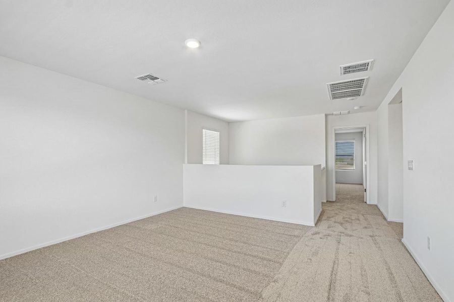 Spacious, unfurnished interior of a new home in Bella Camino Traditions, San Tan Valley (Image 12).