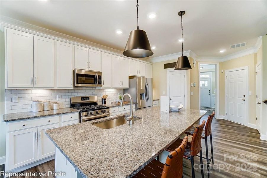 Kitchen will feature white cabinets and quartz counters with soft-close drawers