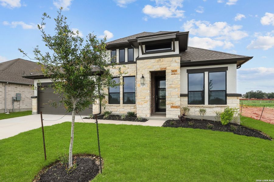 Front exterior of a new home in Buffalo Crossing, Cibolo, TX, highlighting curb appeal (Image 27).