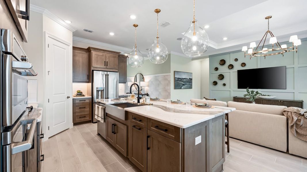 Furnished interior view inside a new home in Esplanade by the Islands, Naples (Image 10).
