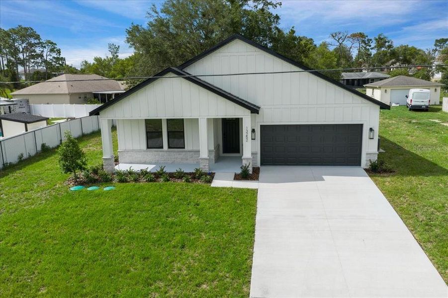 Front exterior of a new home in , Spring Hill, FL, highlighting curb appeal (Image 28).