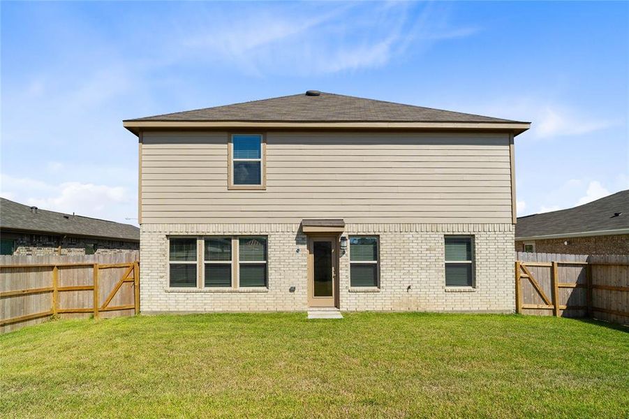 Come and see this spacious backyard with its beautiful covered patio. There is plenty of room for the kids to play and adults to relax!