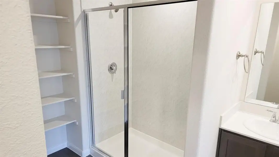 Full bath with vanity and a shower stall Full bath with vanity and a shower stall