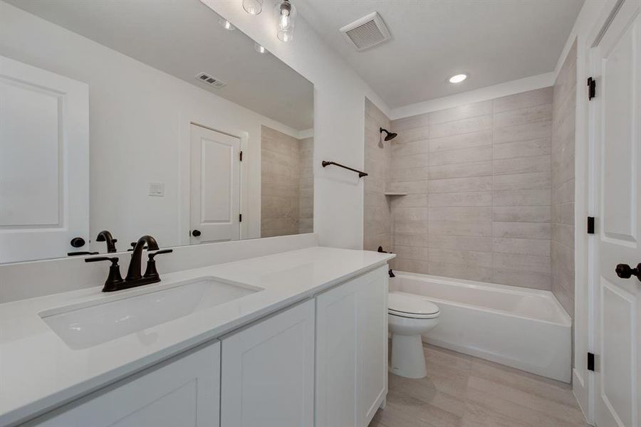Full bath with vanity, shower / tub combination, and recessed lighting Full bath with vanity, shower / tub combination, and recessed lighting