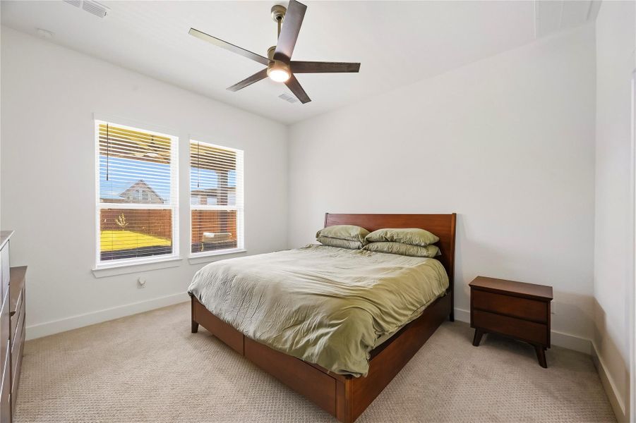 Tucked away on the first floor, the private primary suite offers a peaceful retreat with added separation from the home’s secondary bedrooms. Tucked away on the first floor, the private primary suite offers a peaceful retreat with added separation from the home’s secondary bedrooms.