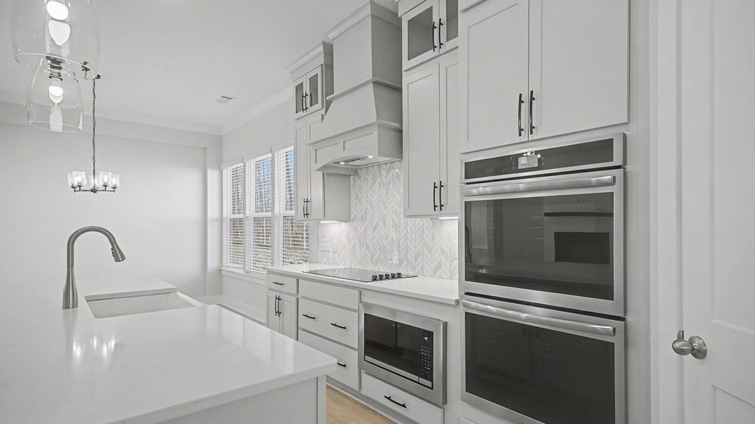 Double wall oven and upgraded range with hood