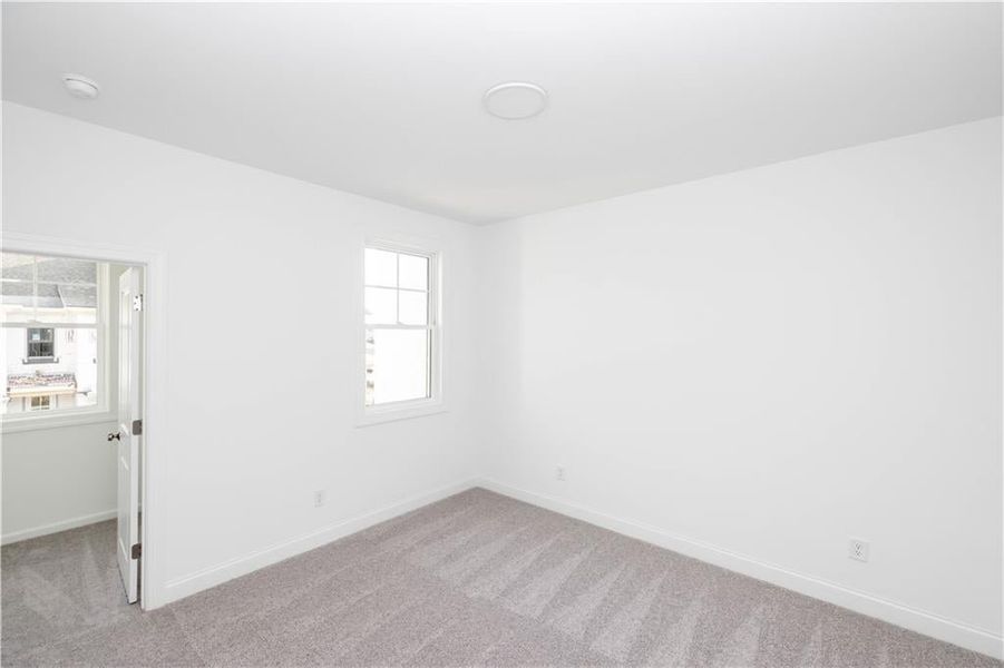 Another view of one of the secondary bedrooms - Pictures represent a previously built home, not the actual home.