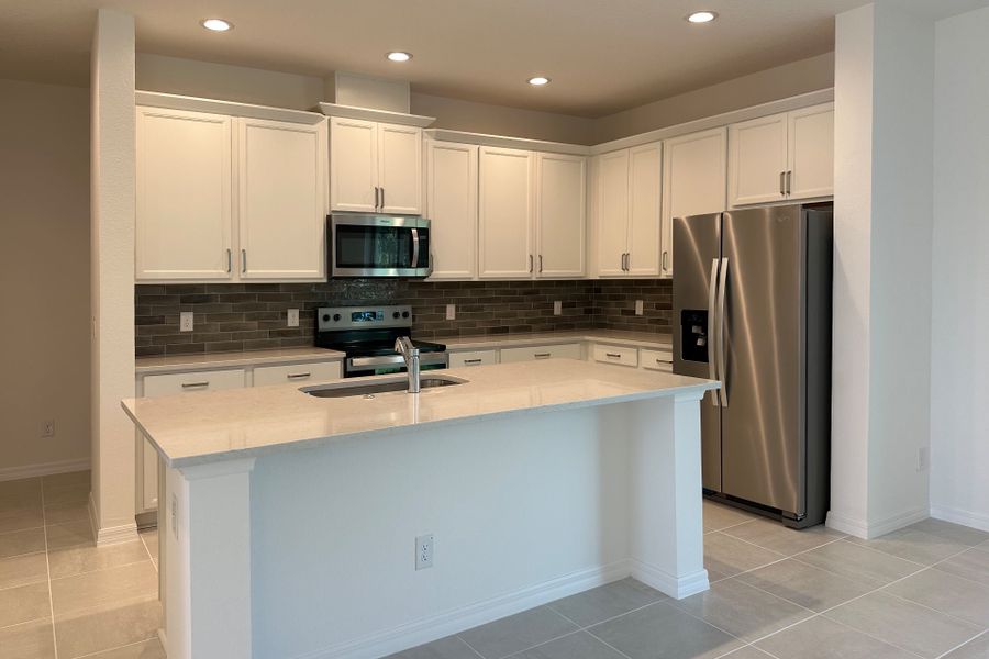 Furnished interior view inside a new home in Trinity Gardens, Deland (Image 4).