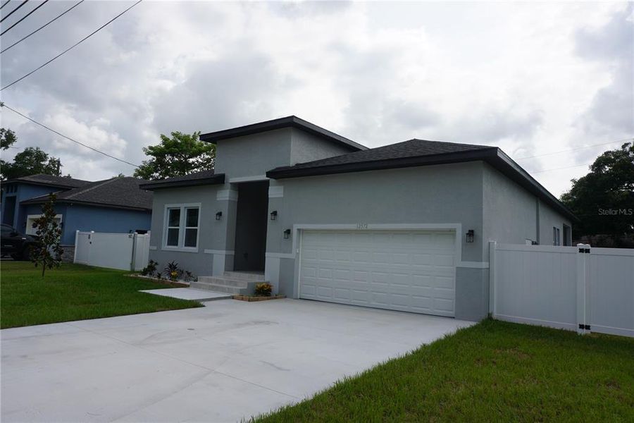 Front exterior of a new home in , Largo, FL, highlighting curb appeal (Image 16). Front exterior of a new home in , Largo, FL, highlighting curb appeal (Image 16).