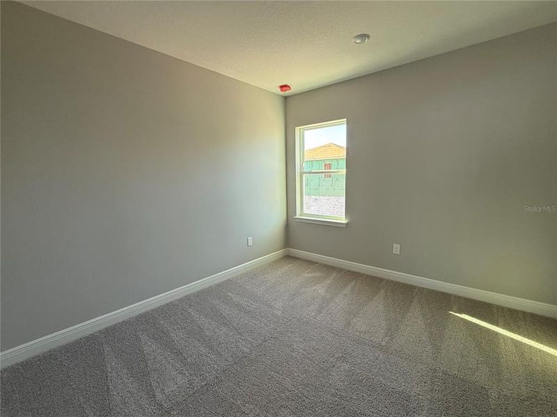 Spacious, unfurnished interior of a new home in Laureate Park, Orlando (Image 24).