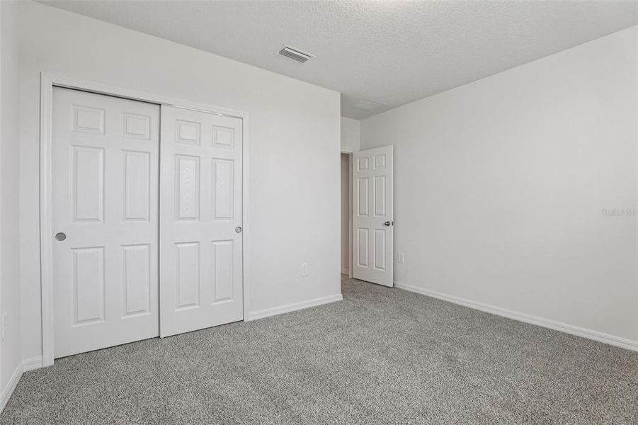 Spacious, unfurnished interior of a new home in Bradbury Creek - Signature Series, Haines City (Image 34).