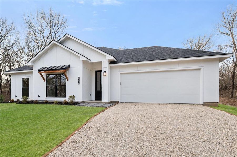 Front exterior of a new home in , Corsicana, TX, highlighting curb appeal (Image 22).