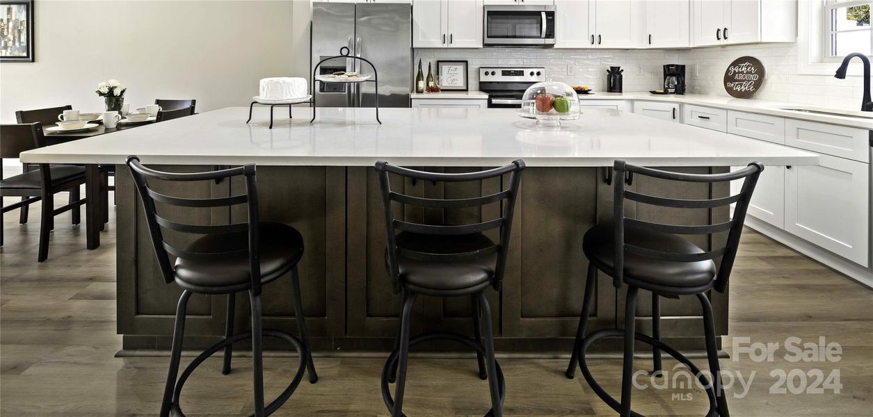 Dining area & 8 foot quartz Island for seating.