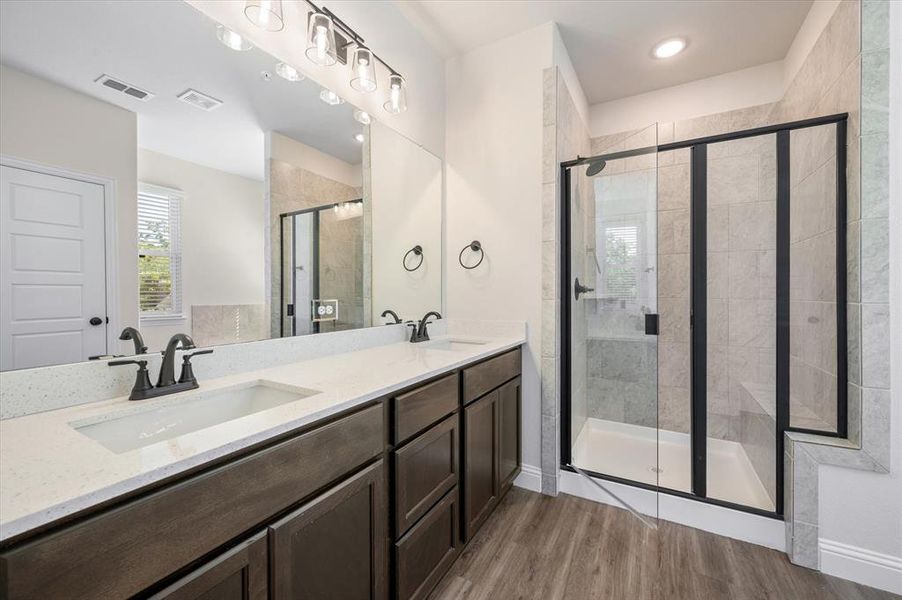 Primary Bath has Quartz, Undermount Dual sinks, Upgraded Fixtures, Closed Door shown is GIANT WALK IN CLOSET