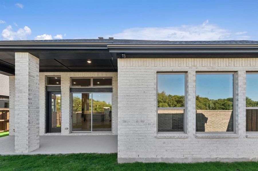 Exterior details and patio area of a home in South Pointe  Cottage Series, Mansfield (Image 2).