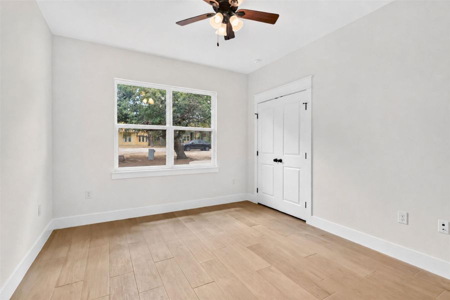 Bedroom #3 without virtual staging facing the front of the home