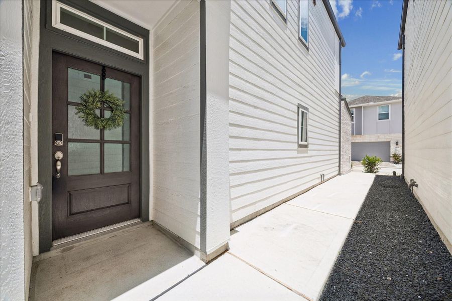 Exterior details and patio area of a home in Dunvale Village - Townhome Collection, Houston (Image 23).