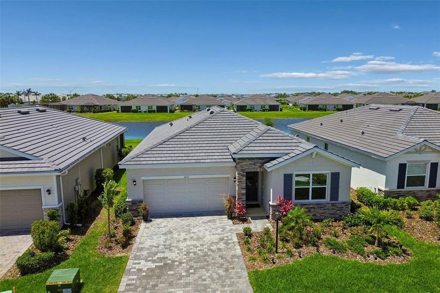 Front exterior of a new home in Star Farms at Lakewood Ranch, Bradenton, FL, highlighting curb appeal (Image 24).