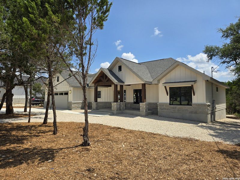 Front exterior of a new home in , Canyon Lake, TX, highlighting curb appeal (Image 28).
