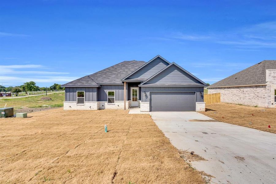 Front exterior of a new home in , Palmer, TX, highlighting curb appeal (Image 26). Front exterior of a new home in , Palmer, TX, highlighting curb appeal (Image 26).