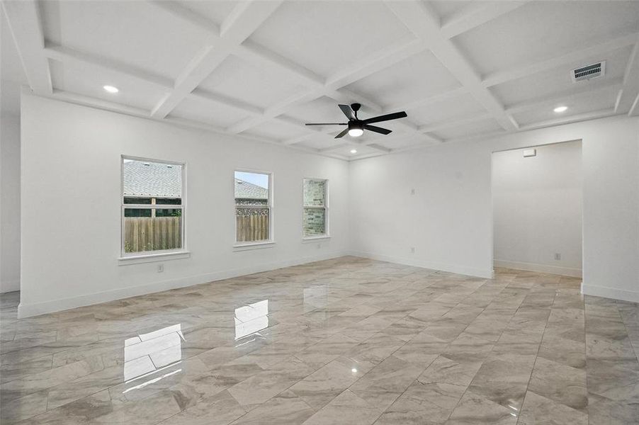 Unfurnished room with coffered ceiling, light marble finish flooring, recessed lighting, beam ceiling, and ceiling fan