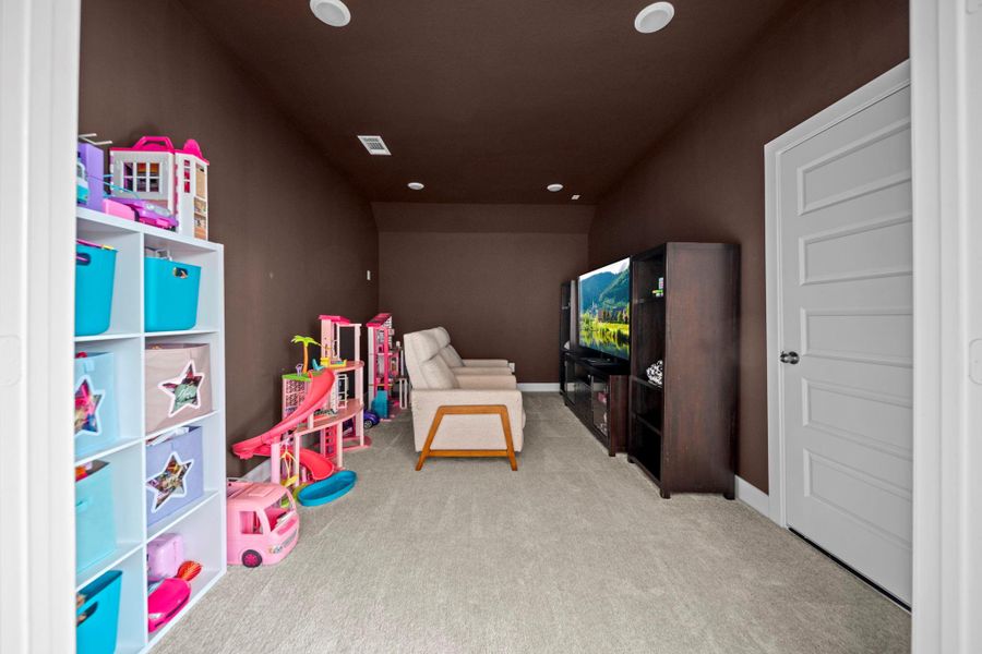 Tucked away for privacy, the media room is ready for movie nights, game days, or streaming marathons. Tucked away for privacy, the media room is ready for movie nights, game days, or streaming marathons.